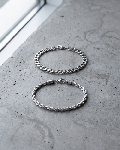 Sablon Stack in silver, both bracelets on grey concrete in window light