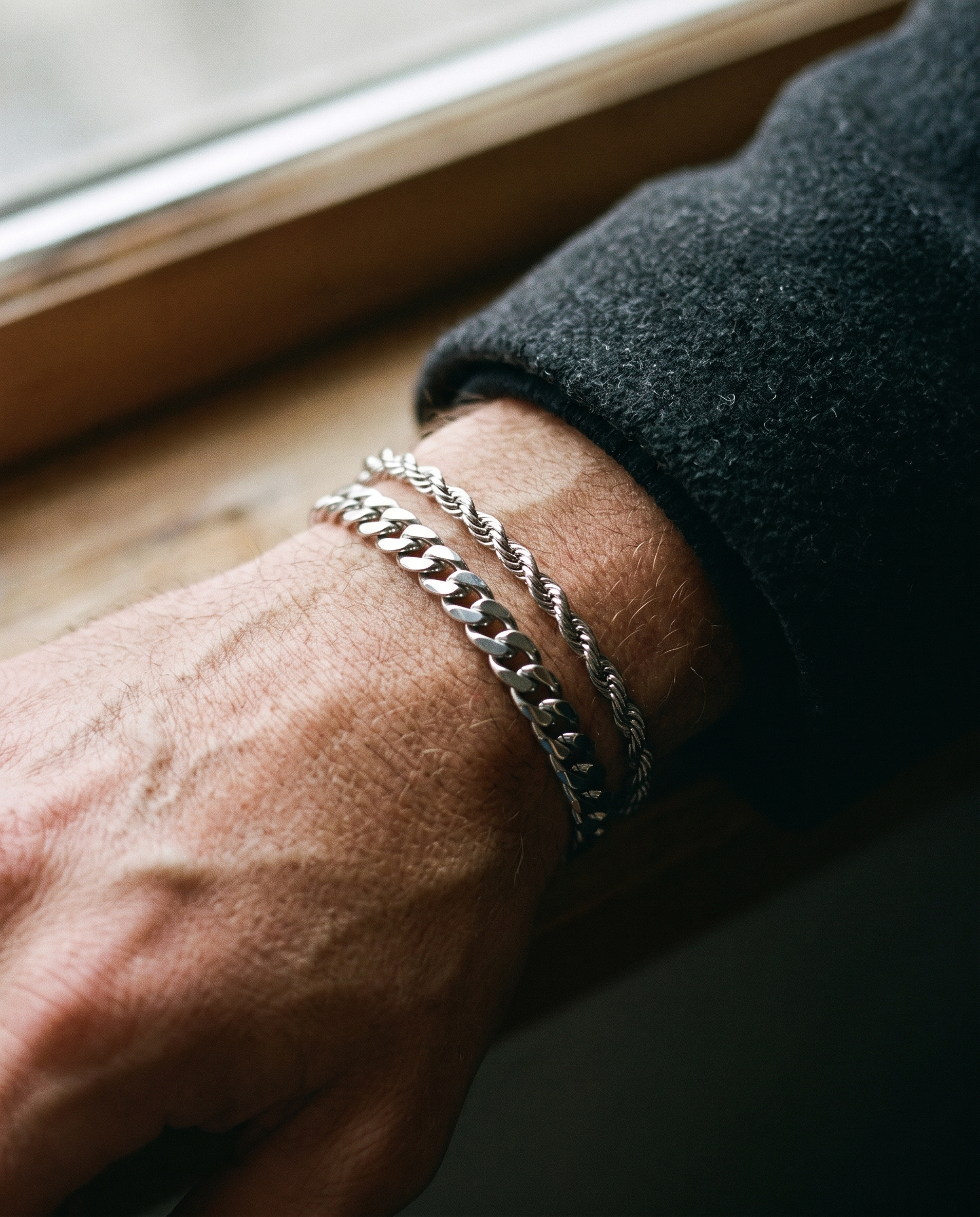 Sablon Stack in silver worn on the wrist under a wool coat cuff