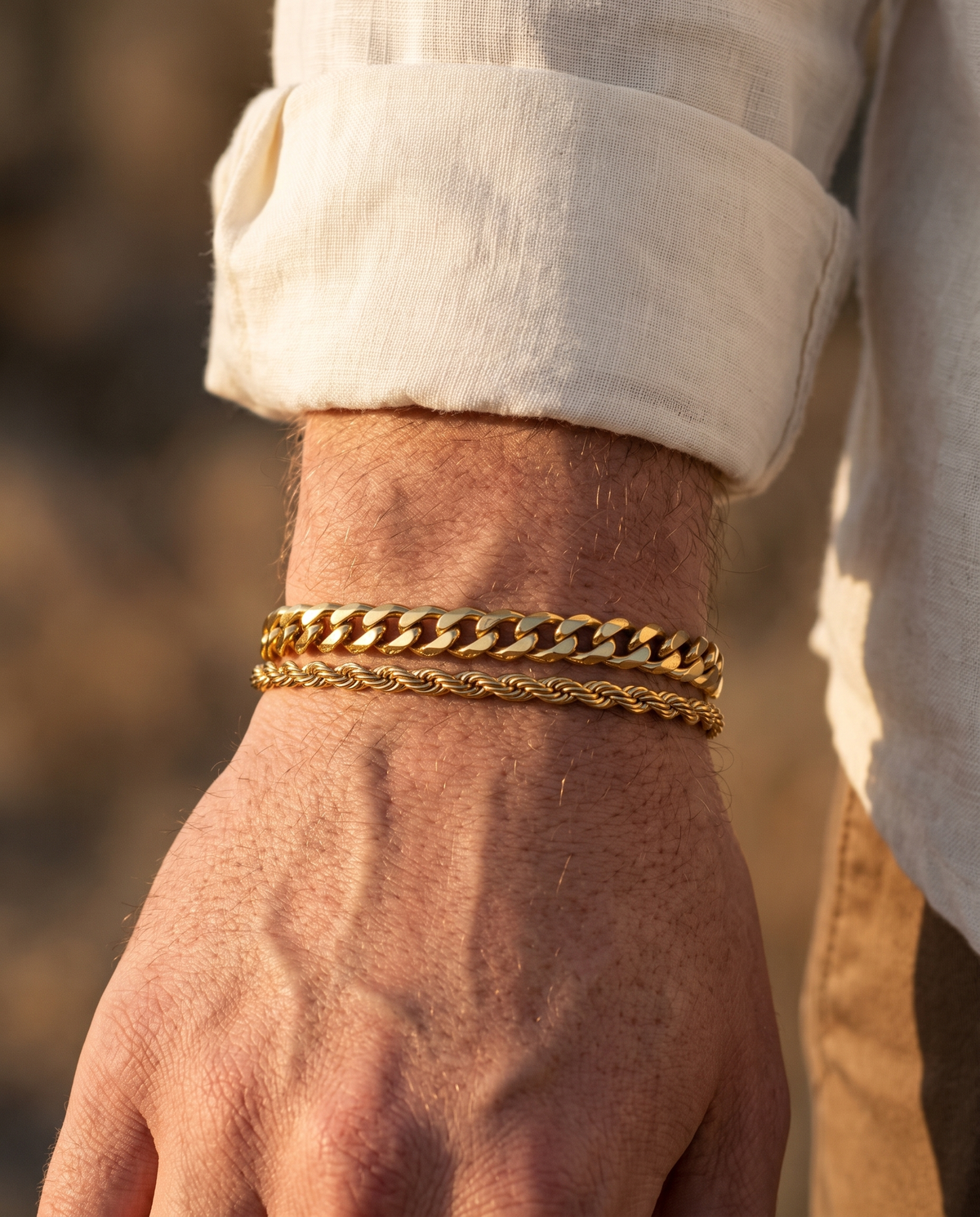 Sablon Stack in gold worn on the wrist under a linen shirt cuff