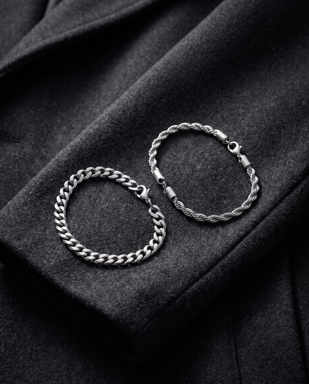 The Sablon Stack in silver on a charcoal wool coat sleeve